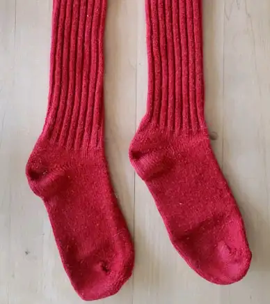 This is a pr. of Vintage Red. Heavy, Long wool Socks. foot size 9 - 11, 100% knit wool. (Not Woven)....