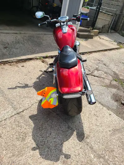 Check out this eye-catching red motorcycle, a true head-turner! While it's a used ride, it's ready f...