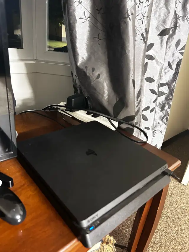 Sony playstation 4 , with a charger62864362175363122