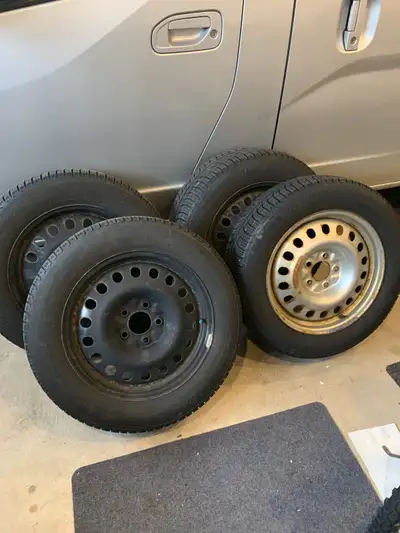 215 60R17. Three black rims, One silver. 6mm tread.