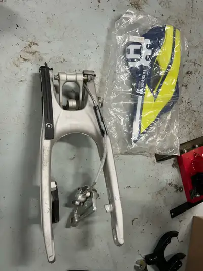 Swingarm with brakes And linkage Rear shock Side plastic Seat Will fit multiple years but it’s from...