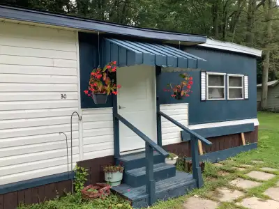 This spacious 840sq ft, 4 season home is a gem in the woods. Located in a 55+ community, Sandy Acres...