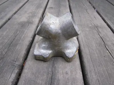 A raw casting of a WJR shovelhead intake manifold. It is too small to fit a Weber or a Dellorto side...