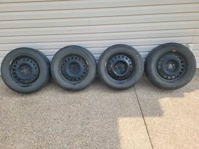 Set of 4 winter tires. Average tread probably good for 1 more season. Rims in decent shape. 225/65r1...