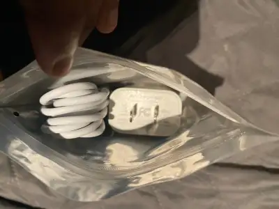 This is a white iPhone charger and cable set. It's designed for fast charging your iPhone or iPad Mi...