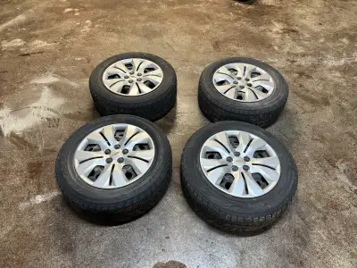 Winter tires off of Chevy Cruze Tires have roughly 50 percent wear, rims are steel with hubcaps. Mak...