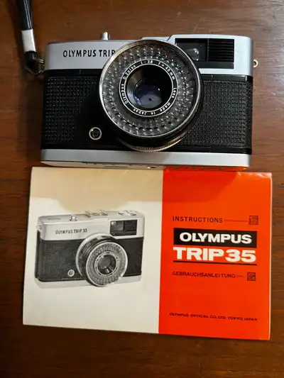 Selling a classic Olympus Trip 35 film camera with its renowned D Zuiko 40mm f2.8 lens. This camera...