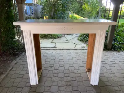 White wooden fireplace mantle, will work well for decorating or an electric fireplace. Sturdy. 42” t...