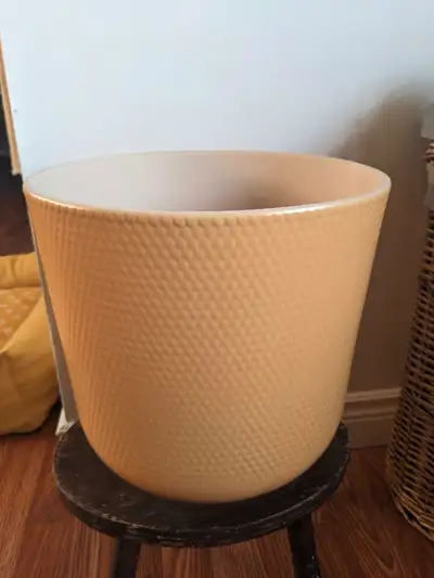 Large dark yellow textured decorative pot, measures 11.5 inches in diameter and 11.5 inches tall. Bo...