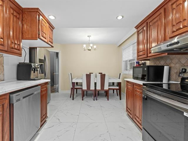 Grand 5 1/2 + sous-sol, stationnement et cours arrière inclus — photo 2