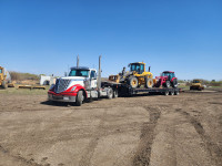 Heavy equipment and car hauling services in Alberta.