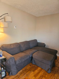 Ikea sofa with chaise and storage ottoman.