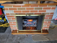 Fake Fireplace wooden / brick. Plugs in and Lights up.