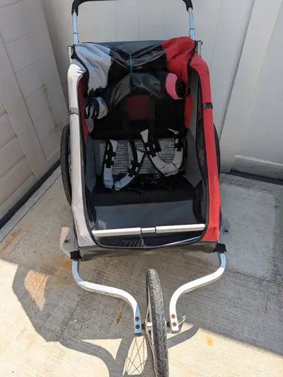 Good condition double Chariot for running or biking. Does not have bicycle connector. Small rip in t...