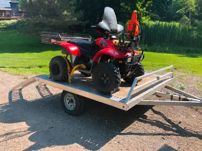 Custom built trailer with trac-lock system down both sides. Holds 2 full size quads or multiple bike...