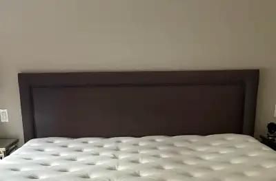 King upholstered solid wood headboard, bed frame included., View more