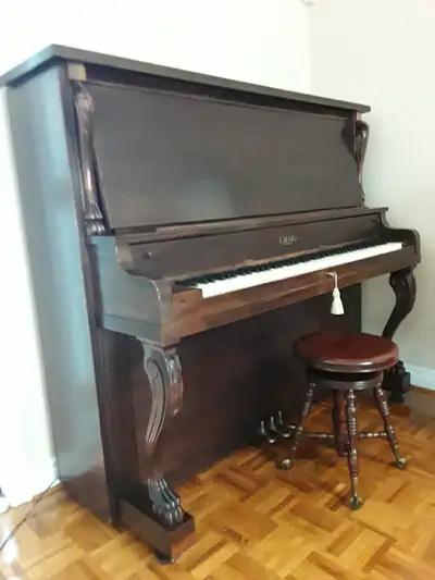 ANTIQUE PIANO AND CLAWFEET STOOL, View more