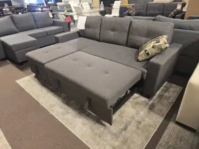 A premium sectional designed for modern living. Featuring soft tufted seating and a smooth pull-out...
