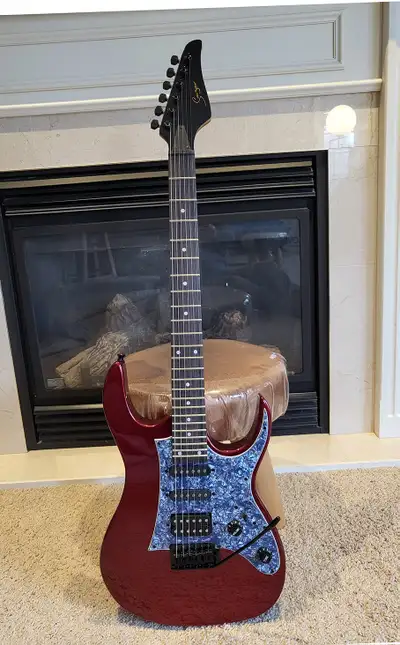 We’re offering this brand new electric guitar, ideal for beginners and intermediate players alike. R...