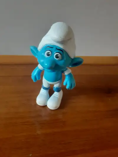 Panicky Smurf figurine, a character from "The Smurfs," a series of comics and cartoons created by Be...