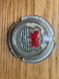 Vintage automotive emblems and horn buttons 