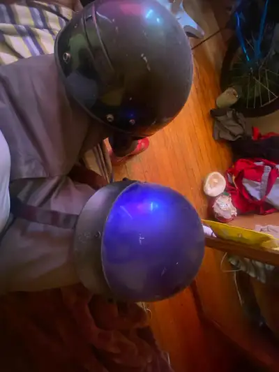 Selling two motorcycle helmets in used condition. They have some wear and tear, as you can see in th...