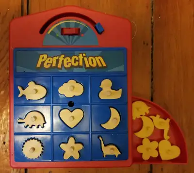 I'm selling a mini Perfection game. Some of the original pieces were lost so I made wood replacement...