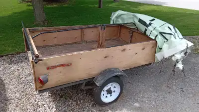 Utility trailer 7ftx4ft box on 9 ft frame, racks on top for small boat, 12 inch tires, spare tire, t...