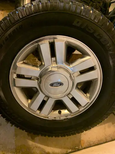 Set of 4 F150 rims with centre caps. Studded winter tires with not much life left. $500 obo.