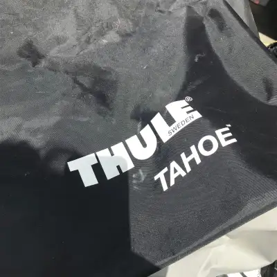 New Thule Tahoe rooftop storage bag for suv with storage bag. Used once. Black and grey heavy duty a...