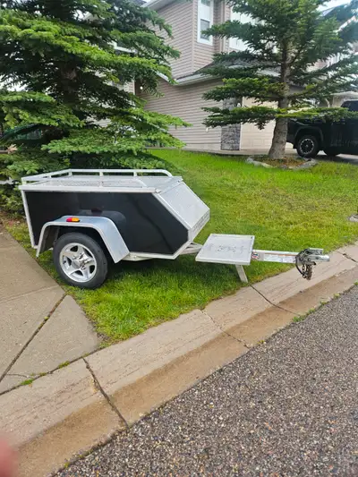 2006 Aluma utility trailer. Great trailer for vehicles to haul items in a water proof compartment su...