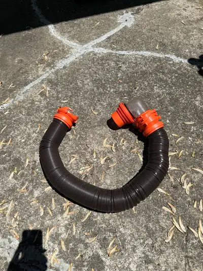 Flex sewer hose extends to 10 feet. Barely used - sold trailer. $20