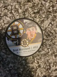 New Boston Bruins Items. Jacket, masks, puck, notebook
