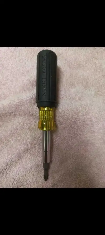 This is a used Klein Tools 11-in-1 screwdriver in good condition, perfect for various electrical and...