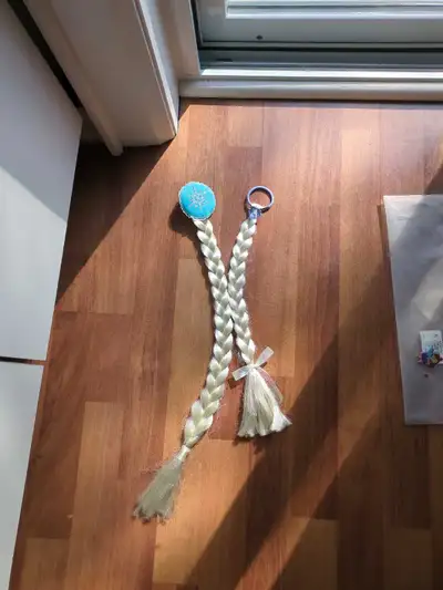 For sale are these Elsa Frozen Costume pony tail accessories. $5 for the pair. Pickup near Casa Loma...