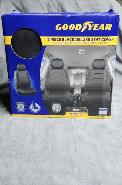 New in Box 2 PC Black Deluxe seat covers Leater finish Asking $10 Pick up in Calvin Cash or Etranser...