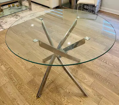 Elegant and stylish Round Shape glass dining table with tempered glass top. Table diameter: 44” and...