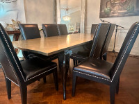 Stunning dining silver leaf table with 8 leathers studded chairs
