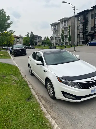 Up for sale a KIA OPTIMA 2013 in very good running condition! Comes with tow sets of tires (summers...