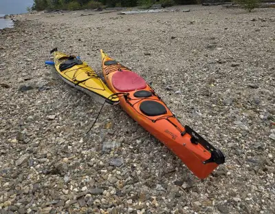 16.5 foot, orange, Riot, touring Kayak, skagg, rudder, 2 large storage compartments as well as a day...