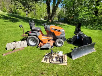 2015 27hp Husqvarana Garden Tractor with Bercomac 44" Snowblower and 48" Dozer Blade. This is a comp...