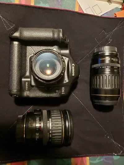 Up for sale is my Canon EOS-1 D Mark II N, a robust and reliable professional DSLR camera, accompani...