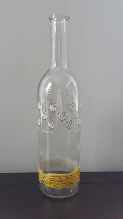 FRENCH designed vintage wine bottle. Clear glass with delightful chicken motif and the words...poule...