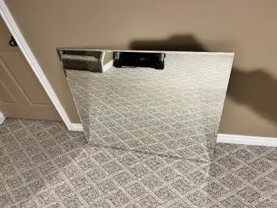 36 inches by 42 inches. Beveled edges.