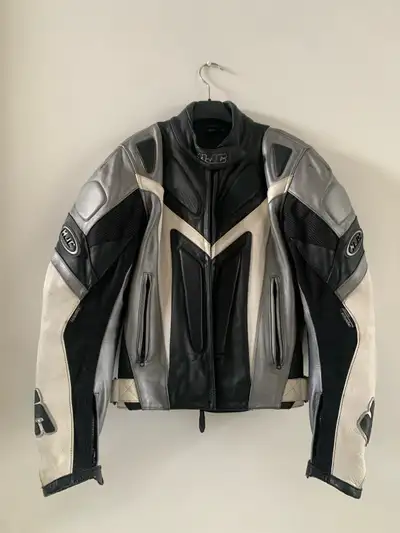 Stay protected on the road with this HJC leather motorcycle jacket, featuring durable construction,...