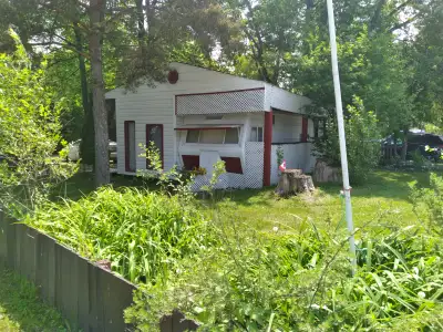 Located at Sandy Mountain Family Campground and Golf 1990 Golden Falcon with rustic add on Fully Equ...