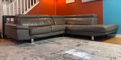 FREE modern grey leather sectional with adjustable headrests. Two parts attach to make one big secti...