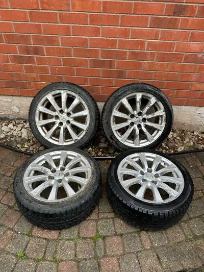 Selling a Set of OEM 17” Lexus IS Rims on Winter Tires. Tire have good tread left. Rims are in rough...