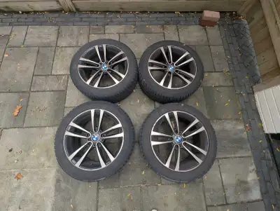Set of 4 bmw rims on winter tires - lots of life left on them Rims: 17IN Tires: 225/50/R17