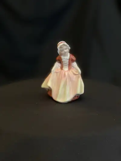 Hand made and hand decorated bone china. Pink and burgundy dress. Rare 1935. Approx 4.7” tall. “Chil...